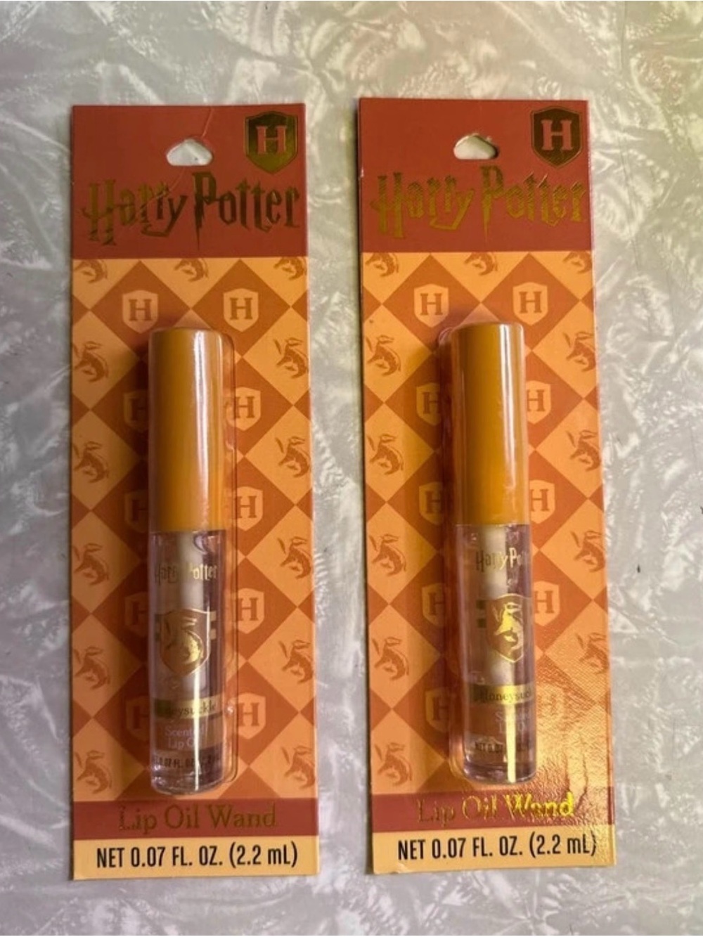 2 Harry Potter Hufflepuff honeysuckle scented lip oil